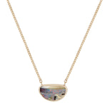 14k yellow gold boulder opal pendant with red and blue flash surrounded by cream layers in a half oval shape, attached to a 14k yellow gold chain