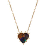 Heart shaped boulder opal pendant in 14k gold with 9 granulated gold orbs arrayed around its exterior attached to a 14k yellow gold chain.  The is striated in colors of rust and deep blue with flashes of bright blue and green towards the bottom of the heart.