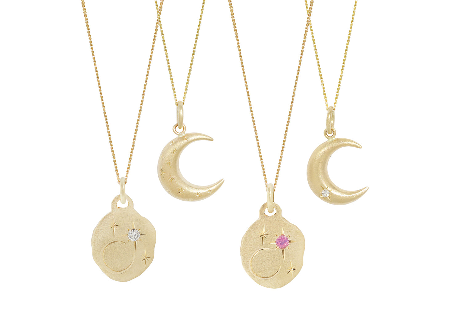 Top row is two engraved crescent moon pendants, bottom row is two night sky pendants, including the diamond version available here.  Each is hanging from its own chain.