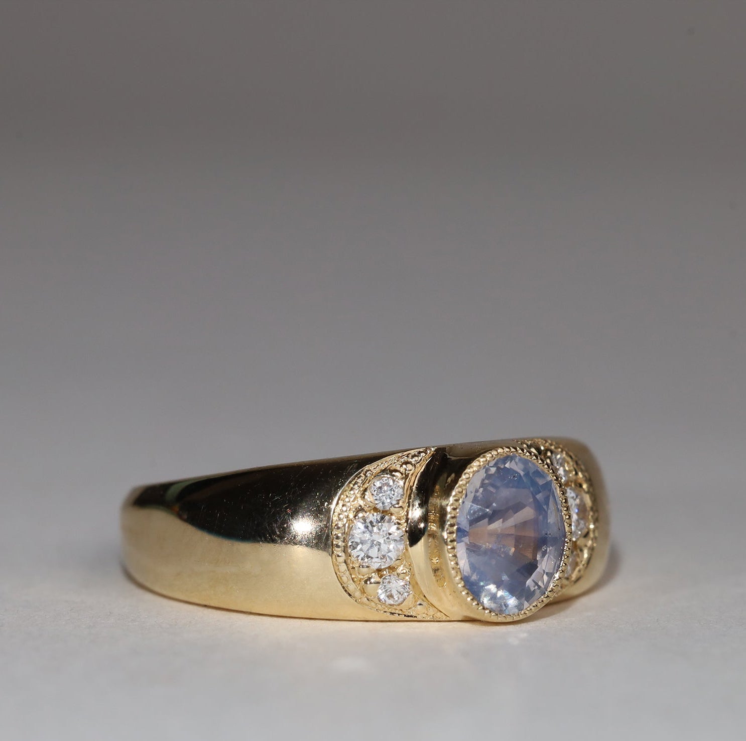 Gold, sapphire and diamond ring in three quarter view