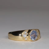 Gold, sapphire and diamond ring in three quarter view