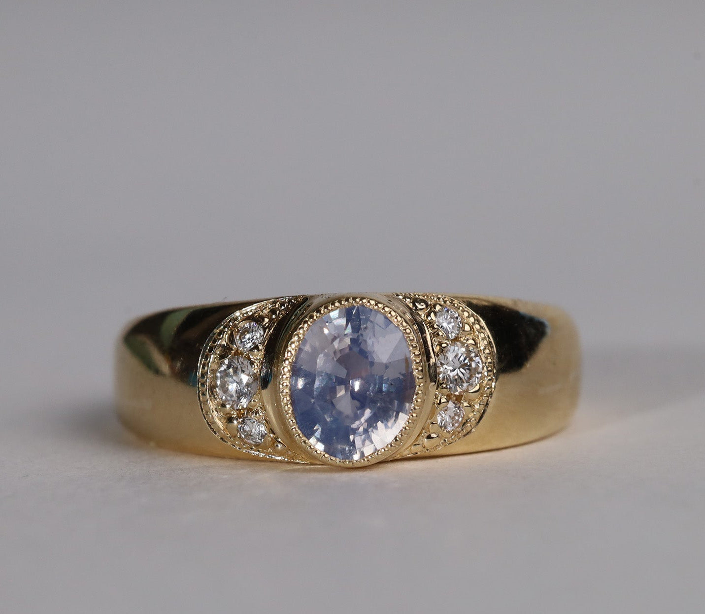 Gold, sapphire and diamond ring in front view