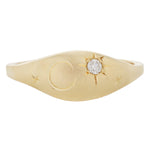 Front view of 14k yellow gold pinky ring with diamond set in engraved star and additional engraving of stars and crescent moon.